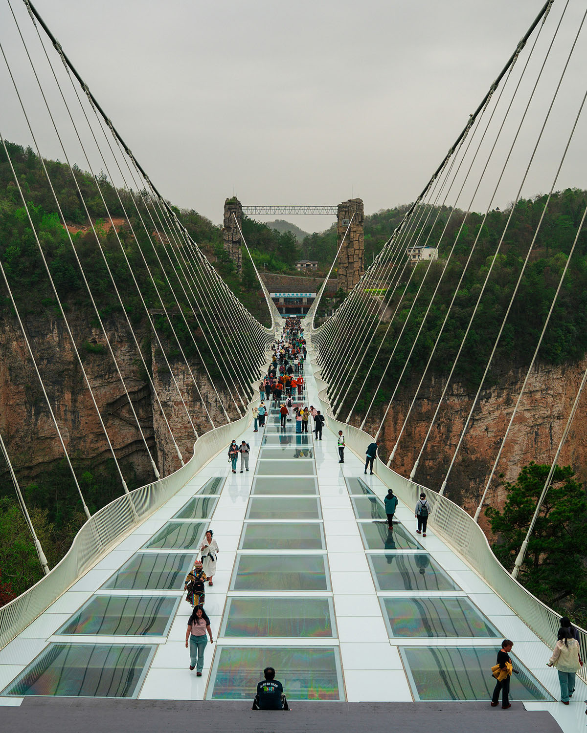 Zhangjiajie Grand Canyon, China. An engineering marvel glass bridge stretches over a gorge in a striking karst landscape. Image: Sergio Kian / Unsplash